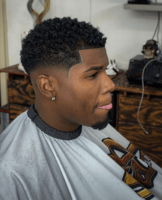 Professional barber giving a signature haircut to a client